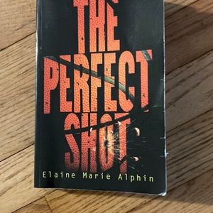 Used paperback book, no writing on pages. Like new. “The perfect shot”